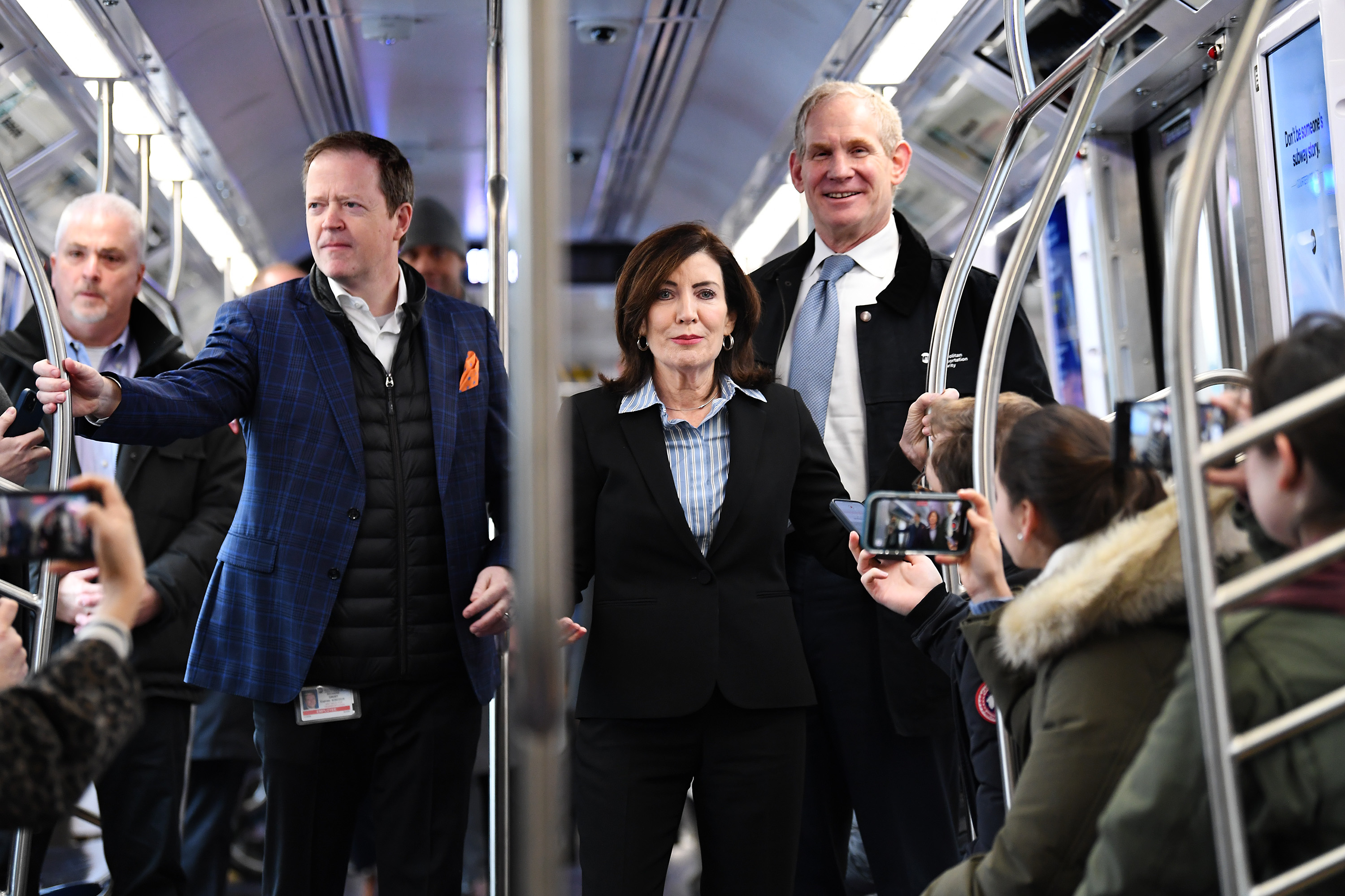 Kathy Hochul, Janno LIeber and Rich Davey on a subway