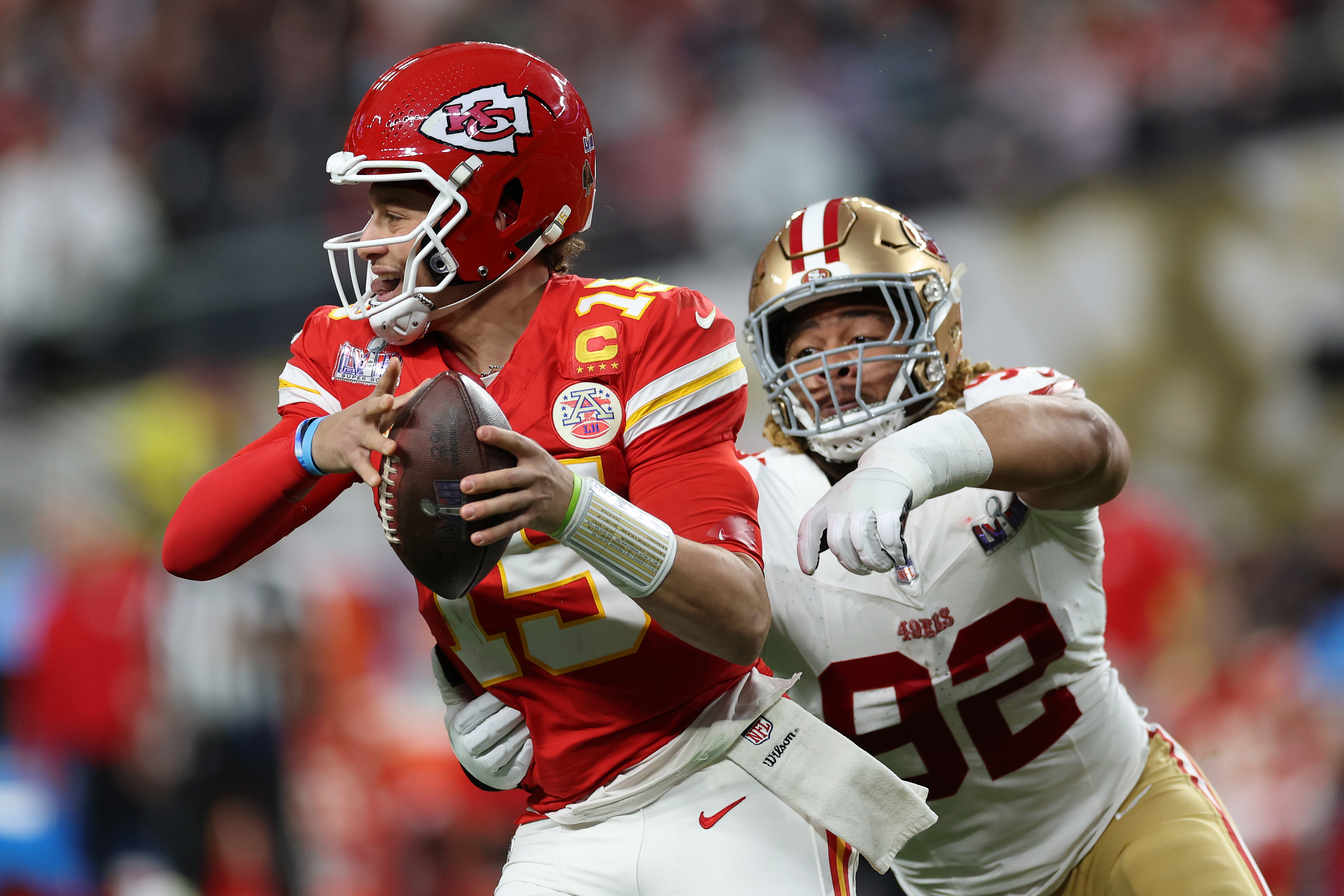 Patrick Mahomes #15 of the Kansas City Chiefs is tackled by Chase Young #92 of the San Francisco 49ers