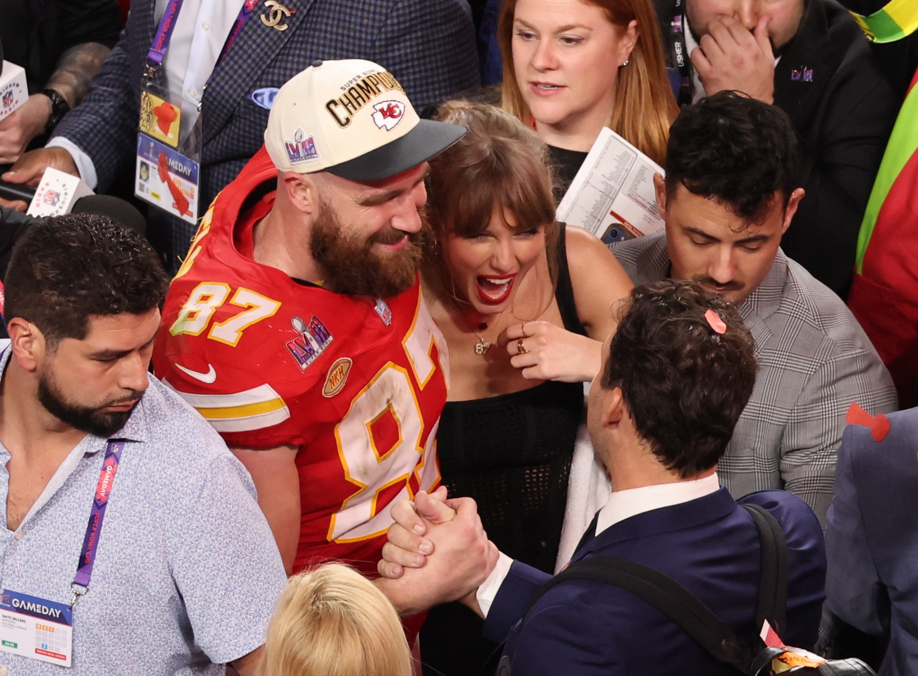 Travis Kelce and Taylor Swift celebrate on the field at Allegiant Stadium on Feb. 11, 2024.