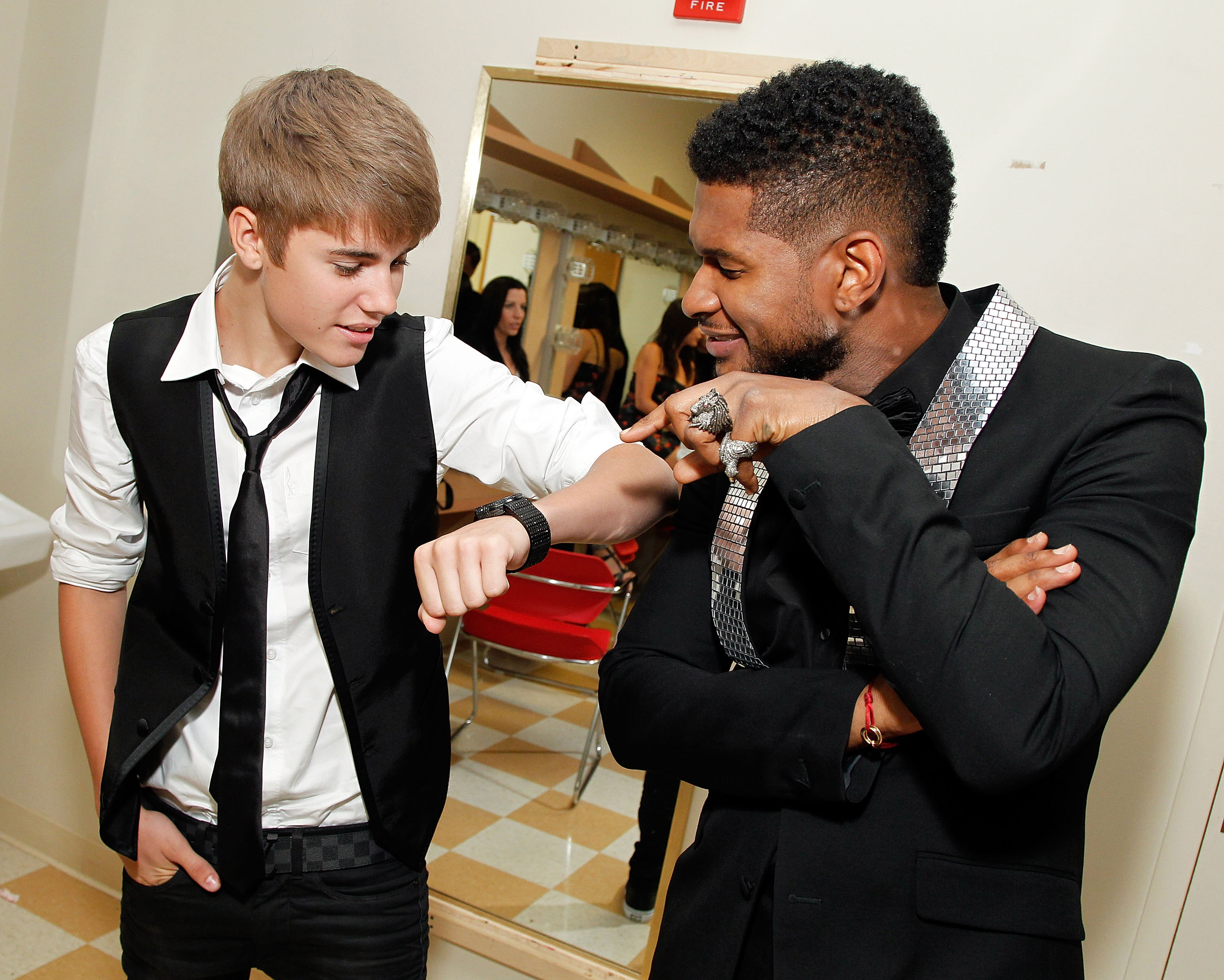 (EXCLUSIVE, Premium Rates Apply) (EXCLUSIVE COVERAGE) Musician and 2011 Horizon Award recipient Justin Bieber poses with musician Usher Raymond backstage at the 33rd Annual Georgia Music Hall Of Fame Awards at the Cobb Energy Performing Arts Center on September 17, 2011 in Atlanta, Georgia.