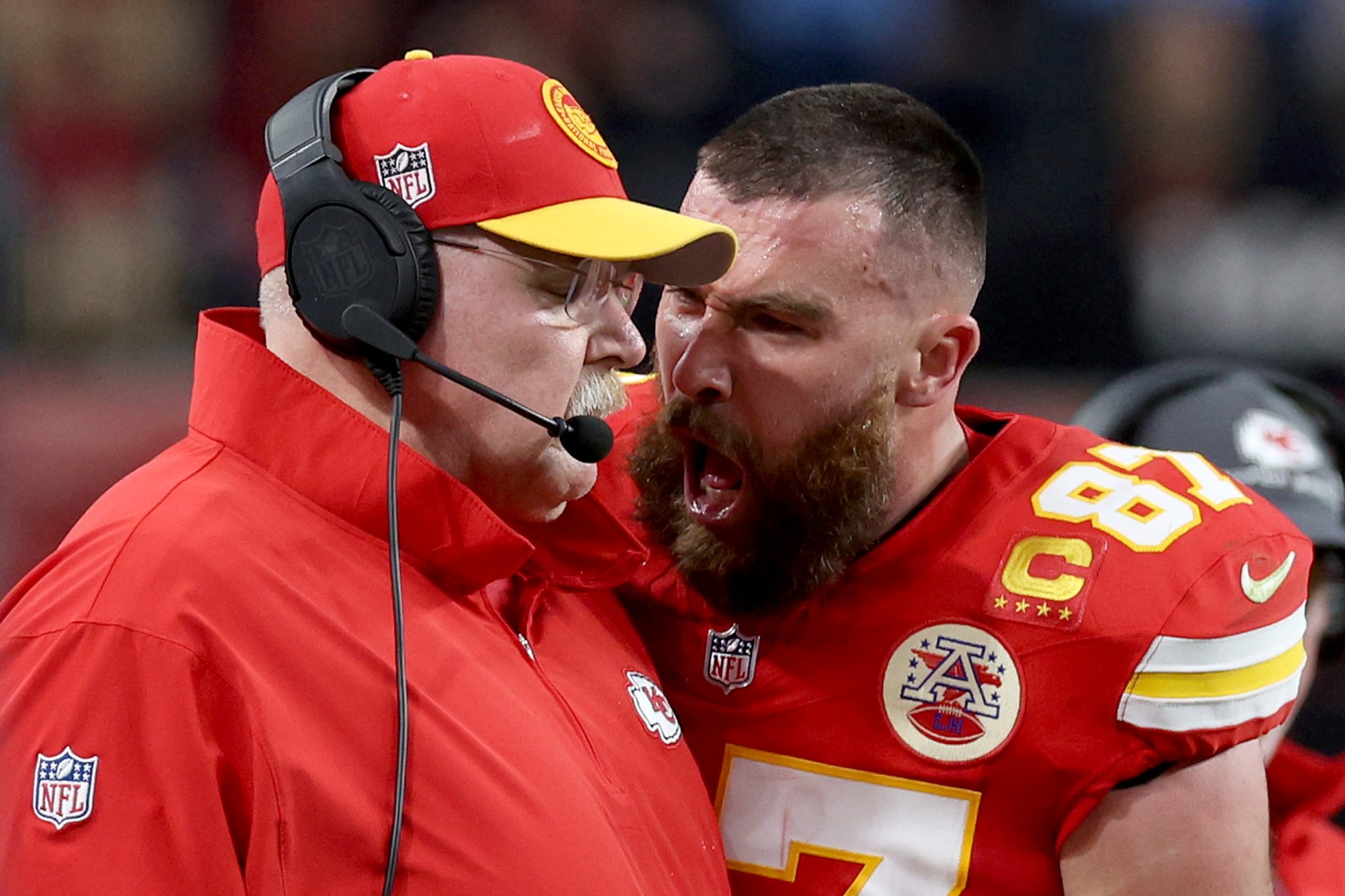 Travis Kelce of the Kansas City Chiefs reacts at Head coach Andy Reid in the first half against the San Francisco 49ers during Super Bowl LVIII.