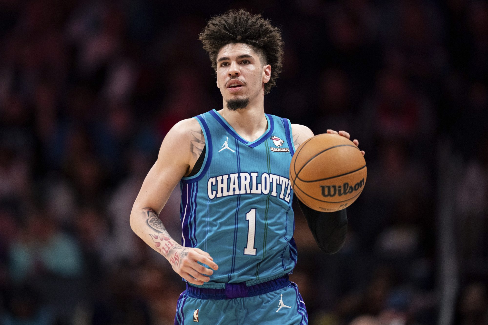 Charlotte Hornets guard LaMelo Ball brings the ball upcourt during the second half of an NBA basketball game against the Houston Rockets, Friday, Jan. 26, 2024, in Charlotte, N.C.
