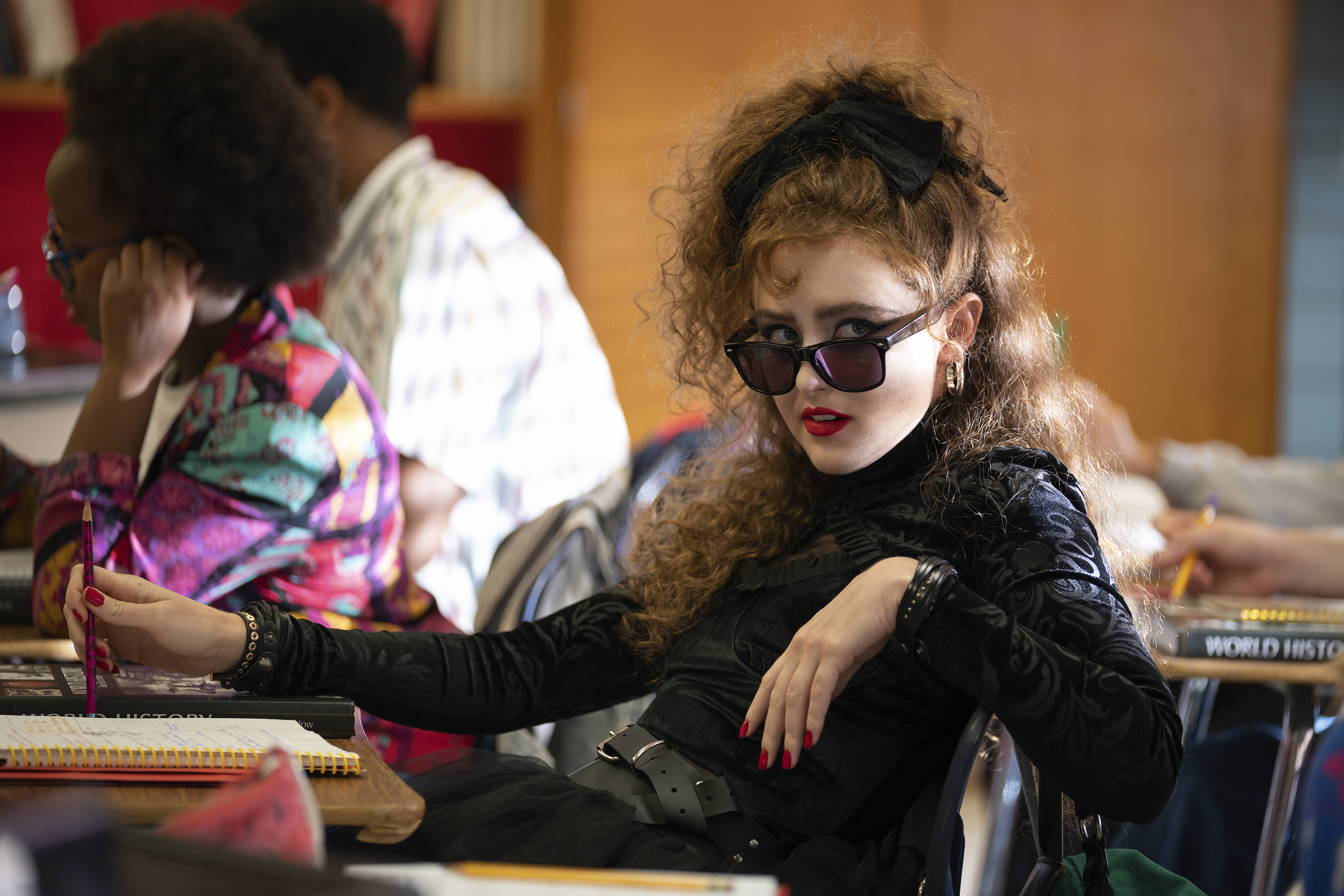 Kathryn Newton in "Lisa Frankenstein" at a desk.