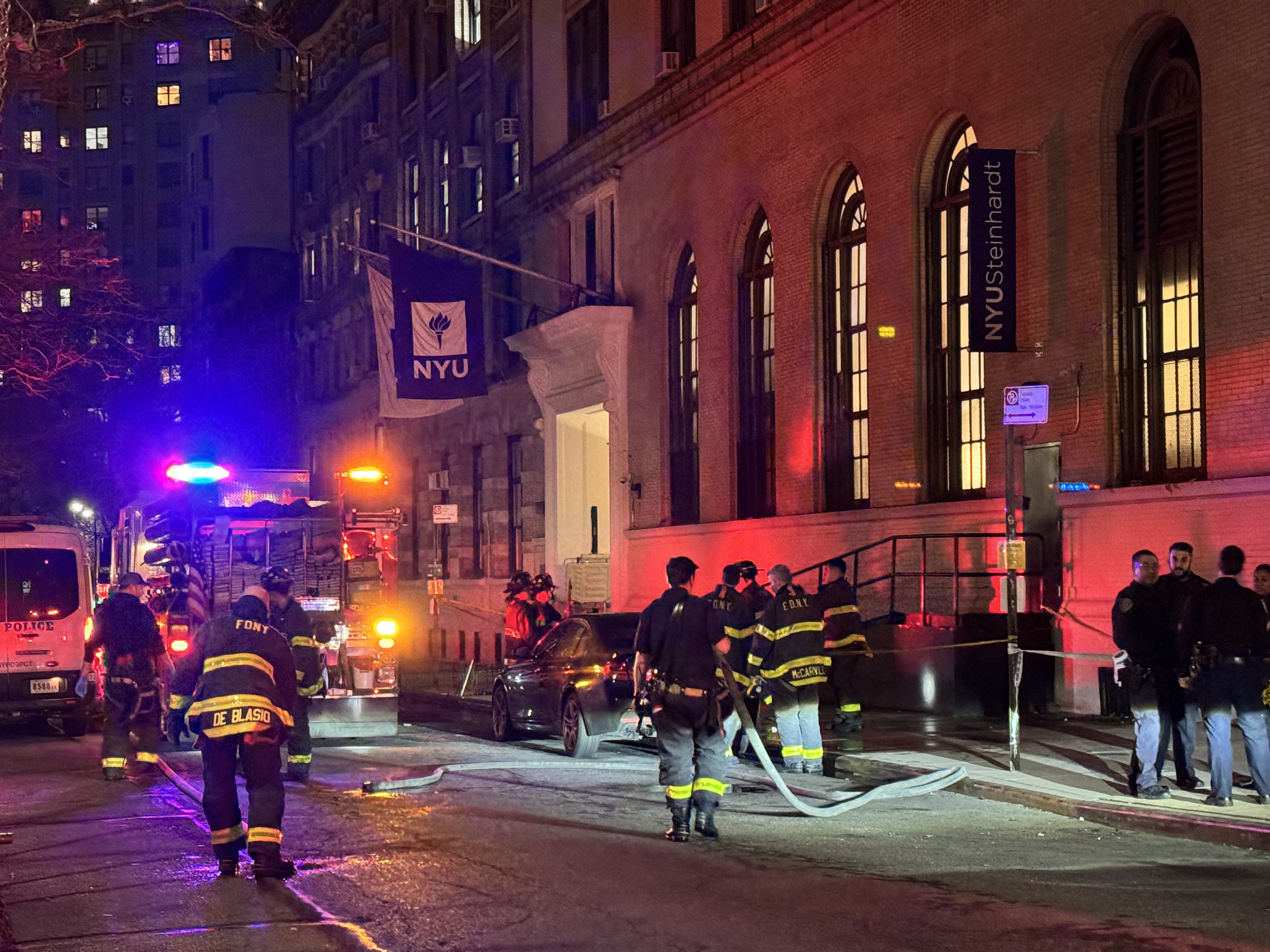 Officers responding to the scene of the suicide at NYU on Saturday night. It remains unclear if the victim was a student