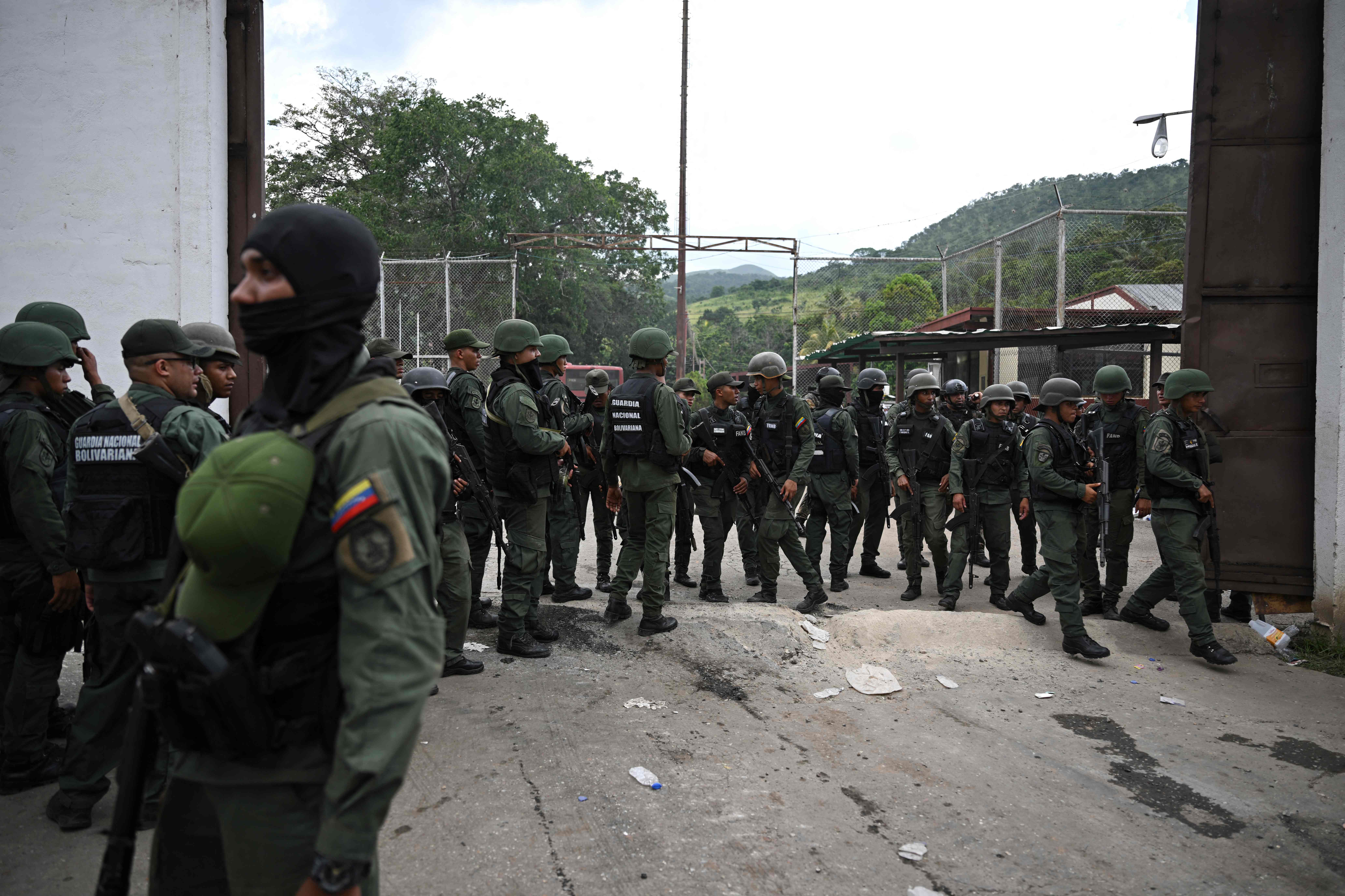 Members of the Bolivarian National Guard stand guard outside Tocoron prison, Venezuela, following a successful plan to fight against "prison mafias".
