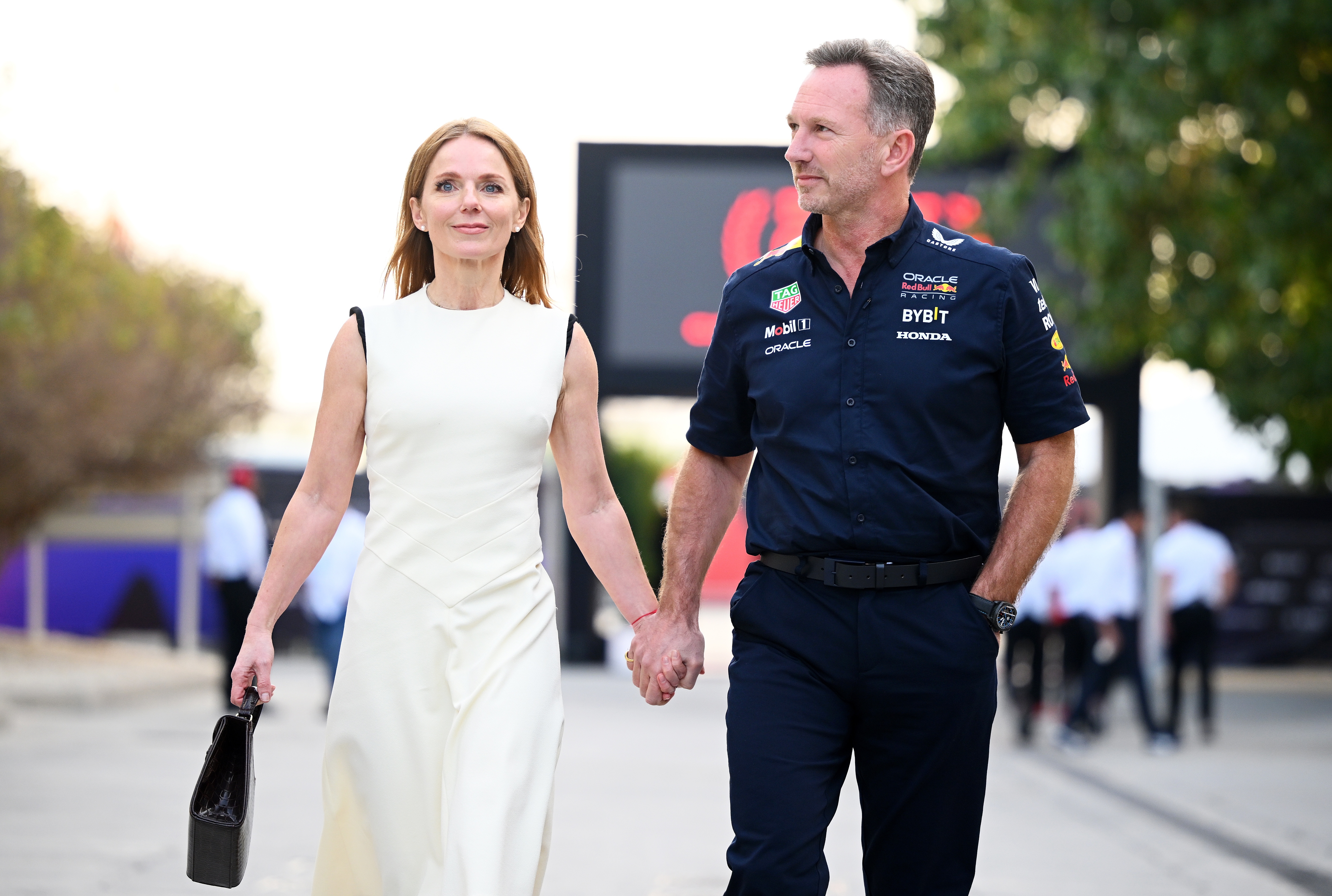 Red Bull Racing Team Principal Christian Horner and Geri Halliwell walk in the Paddock holding hands prior to the F1 Grand Prix of Bahrain at Bahrain International Circuit on March 02, 2024.